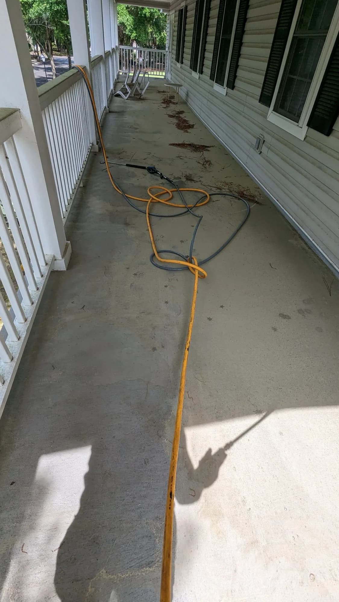 Driveway pressure washing in progress on a Lowcountry home