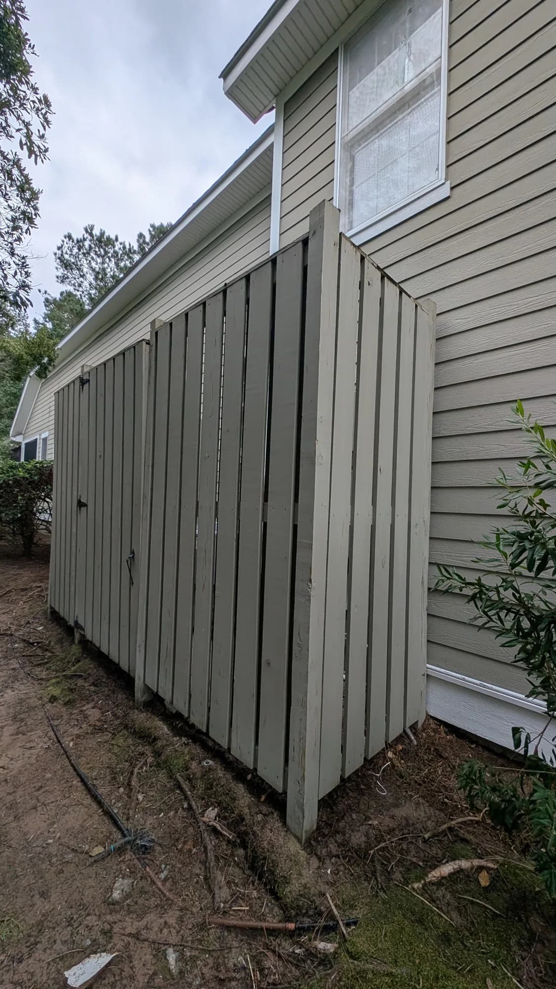 The same fence boards lighter and clean after washing